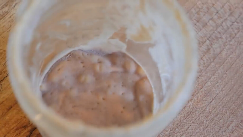 Inactive sourdough starter in a jar.