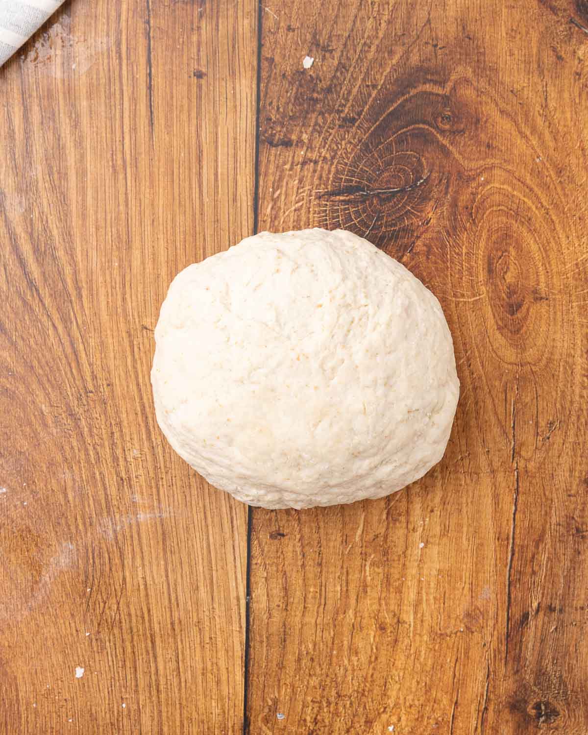 Sourdough sandwich dough in a ball.