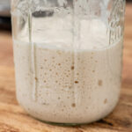 A bubbly jar of sourdough starter.