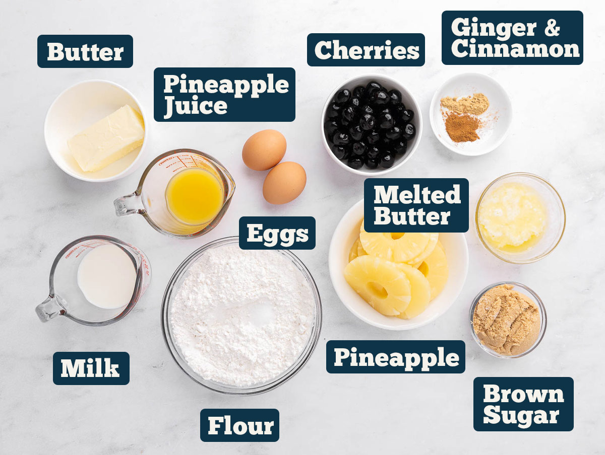 Pineapple upside down cake ingredients: butter, pineapple juice, cherries, cinnamon, ginger, melted butter, pineapple, eggs, flour, milk, and brown sugar.