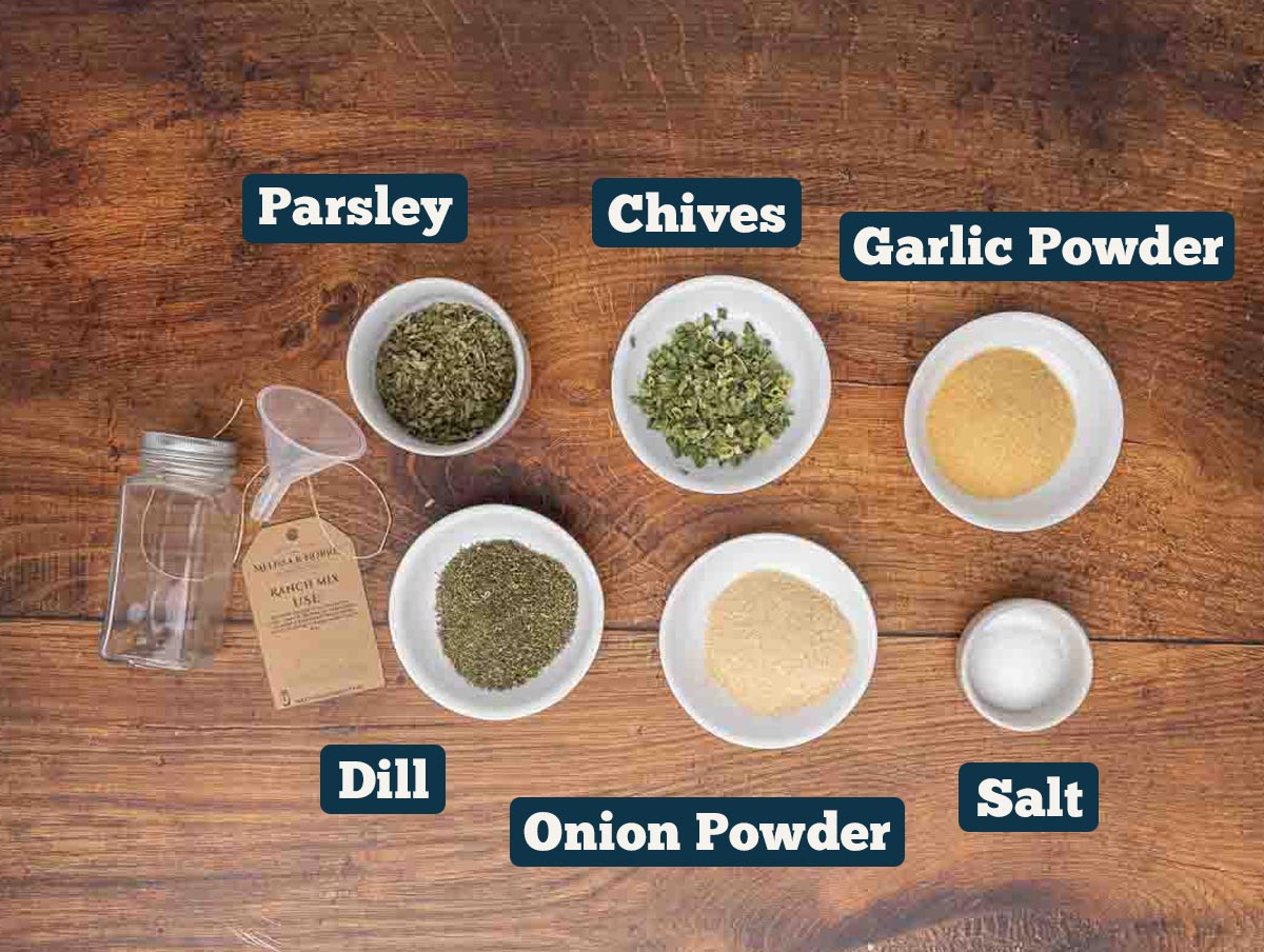 DIY ranch seasoning ingredients: parsley, chives, garlic powder, dill, onion powder, and salt.