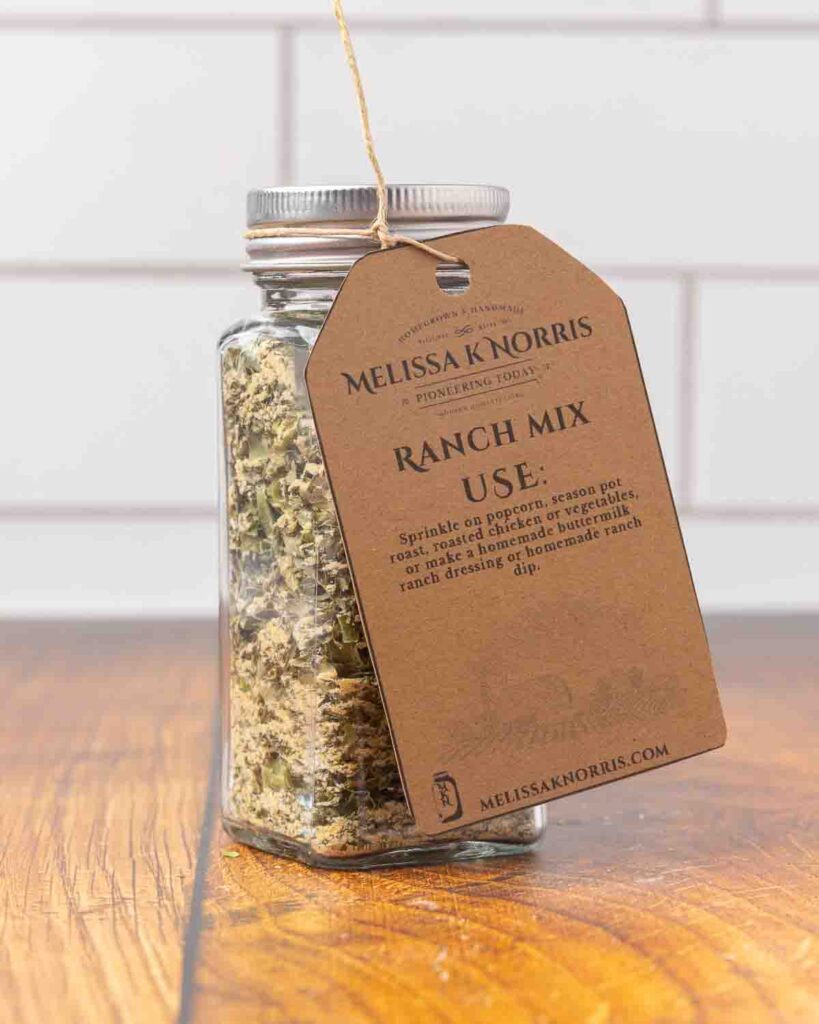A jar filled with DIY ranch seasoning mix, and labeled with a tag.