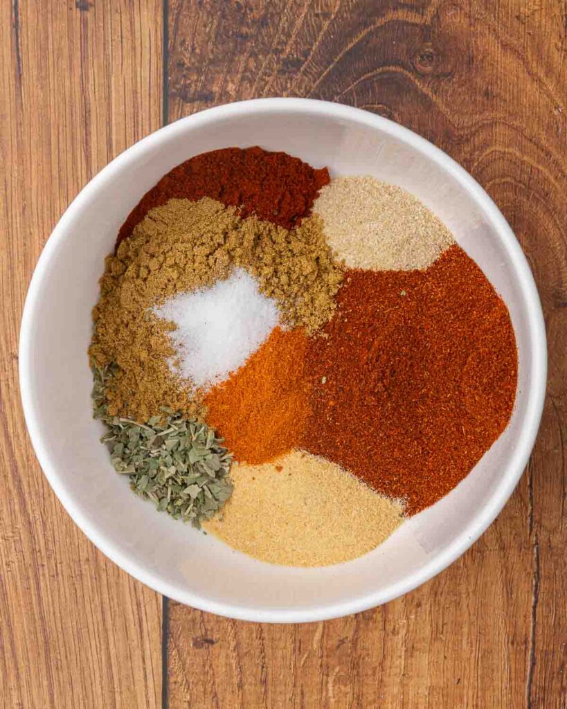 Taco seasoning ingredients layered in a small bowl.