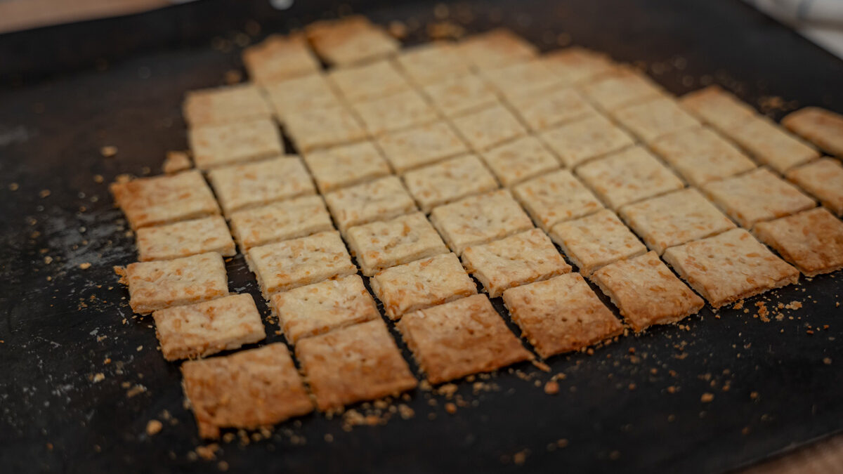 Homemade crackers on a cookie sheet.