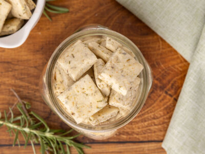Bird's eye view of a glass jar full of Italian crackers.