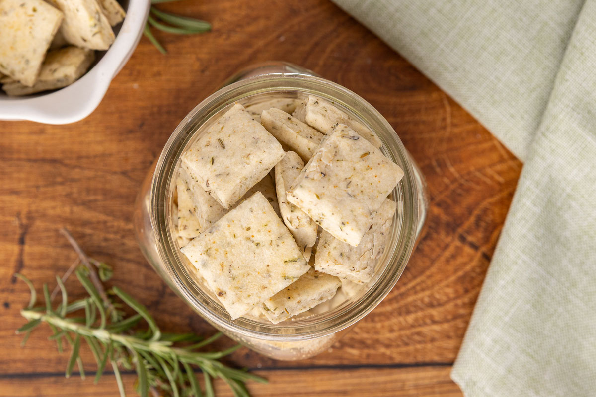 Bird's eye view of a glass jar full of Italian crackers.