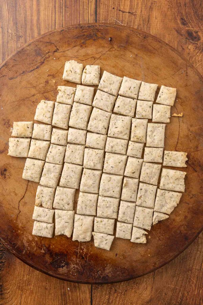 A pizza stone with freshly baked Italian crackers.