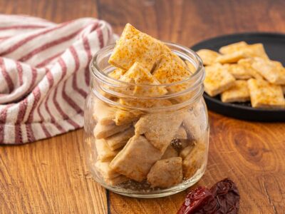 A glass jar full of Mexican crackers.