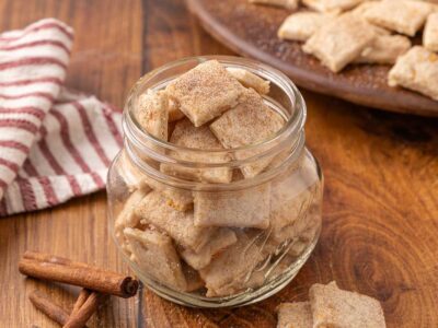 A glass jar full of sweet and salty crackers.