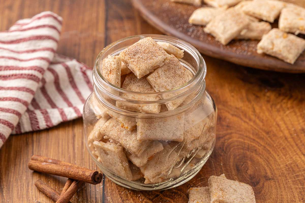 A glass jar full of sweet and salty crackers.