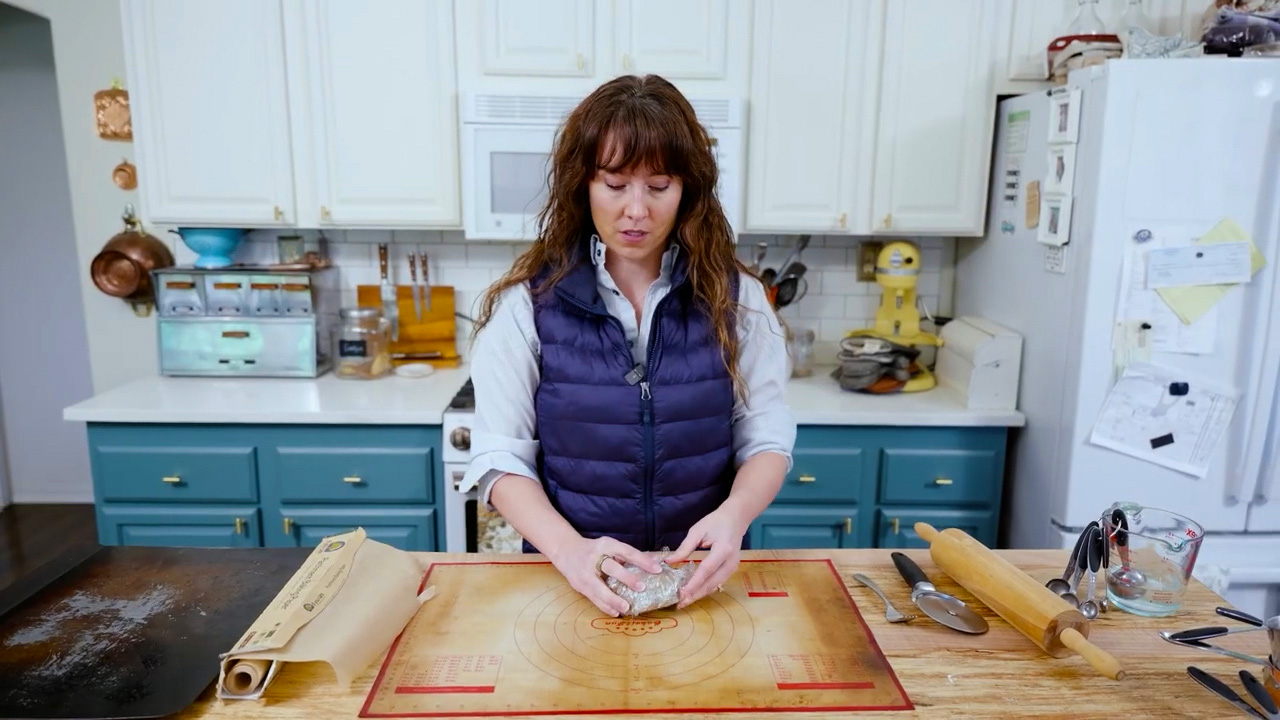 Wrapping graham cracker dough in plastic wrap.