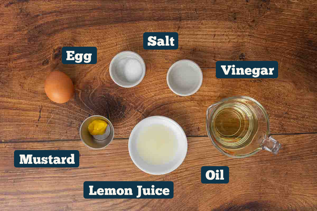 Easy mayo recipe ingredients: salt, vinegar, oil, lemon juice, mustard, and egg.