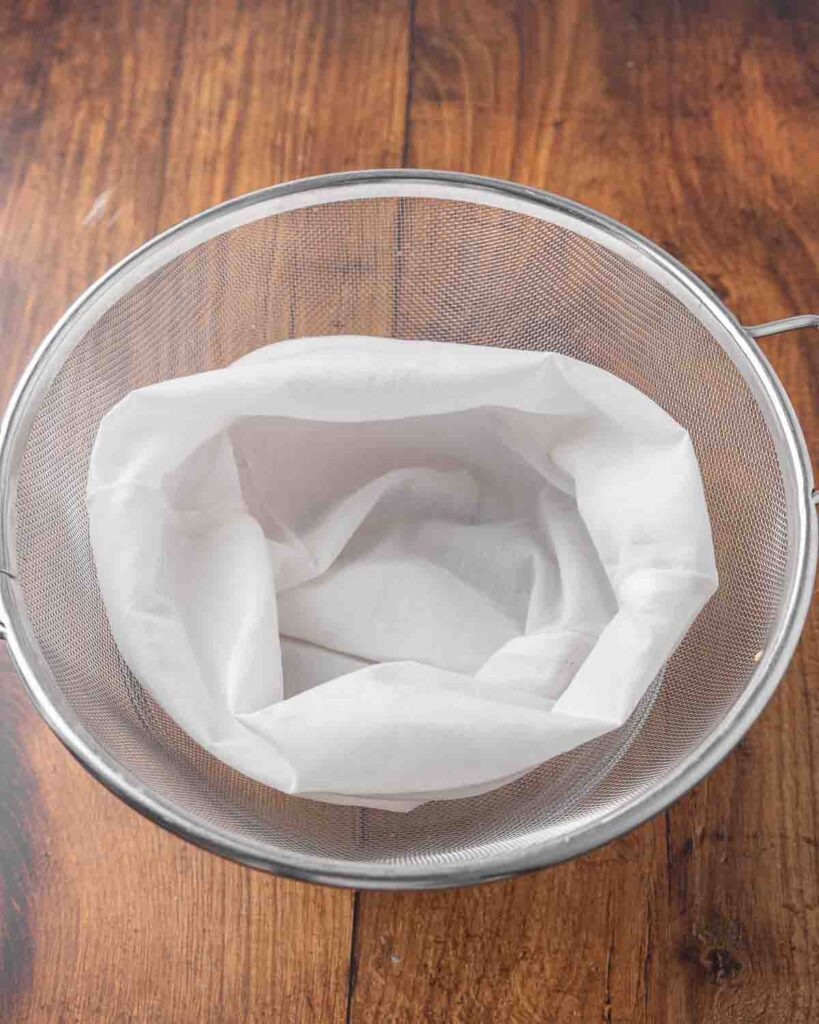 A strainer lined with cheesecloth.