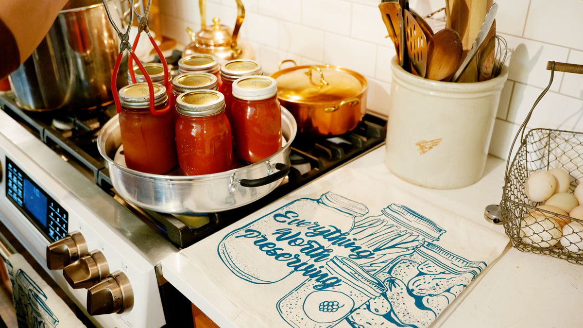 Jars of canned tomato sauce in a steam canner.