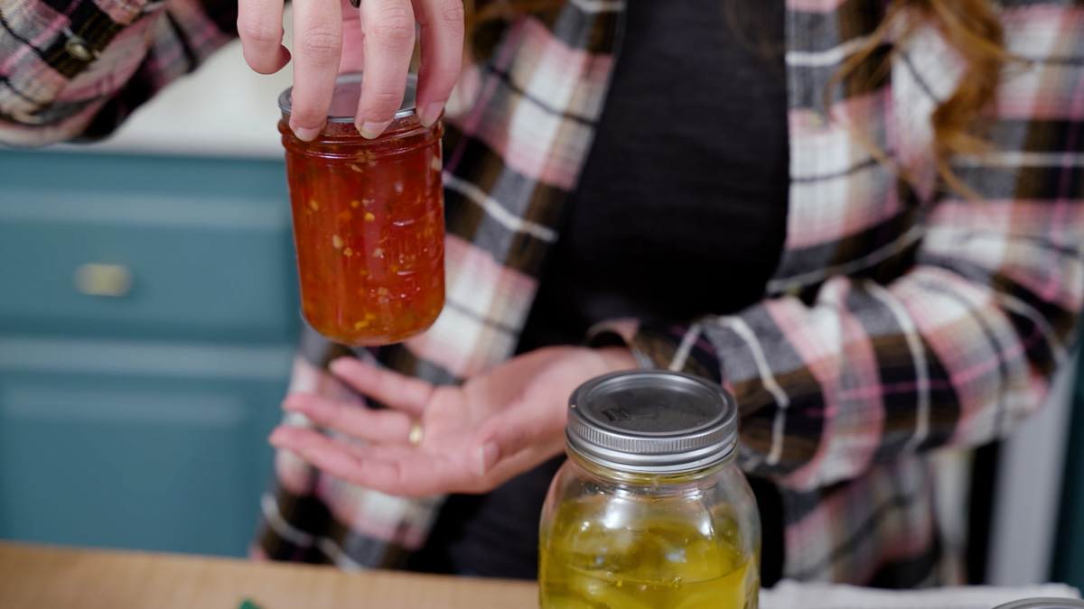 Testing the lid seal of a jar of food.
