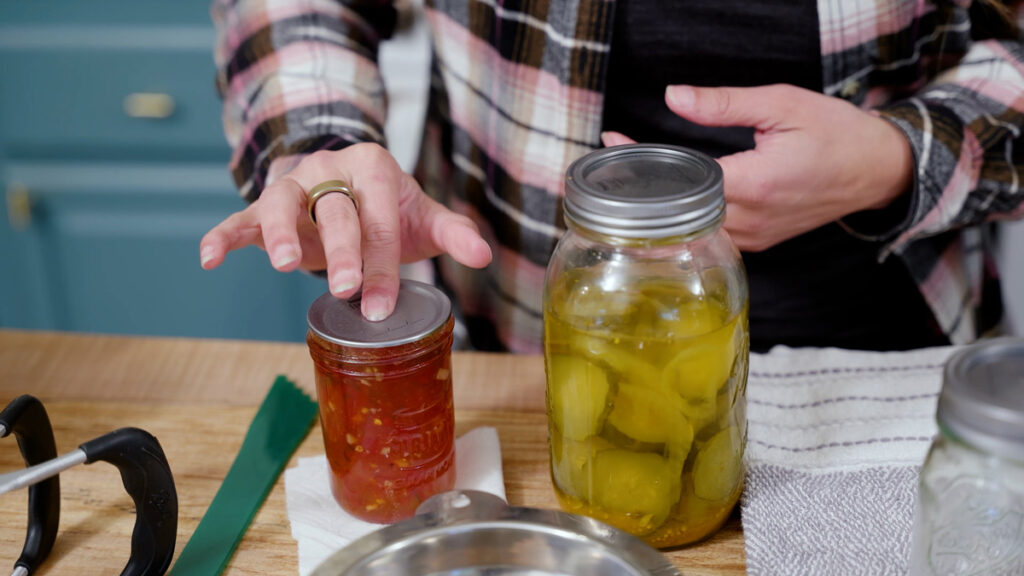 Testing the lid seal of a jar of food.