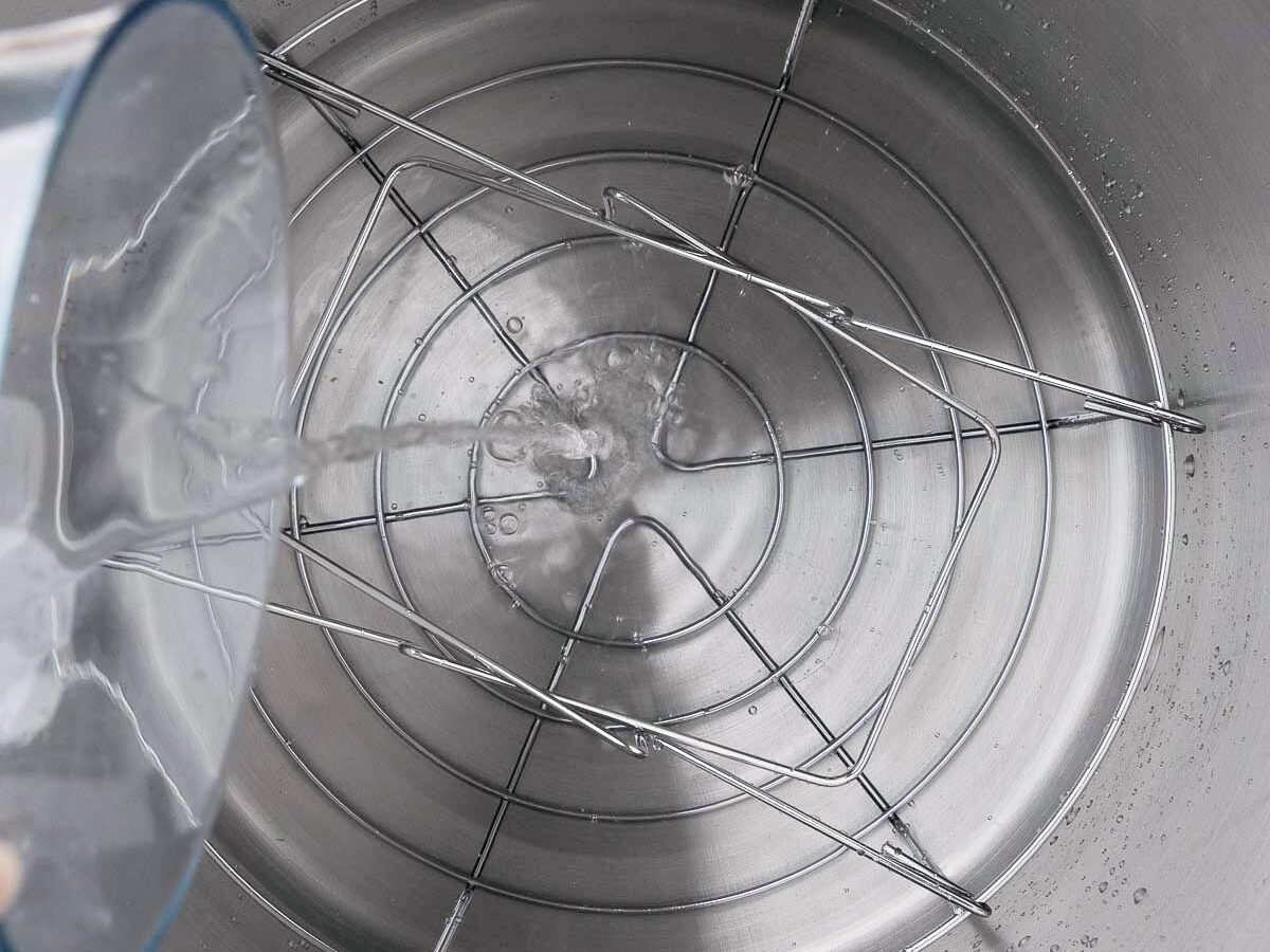 Water being added to a large pot.