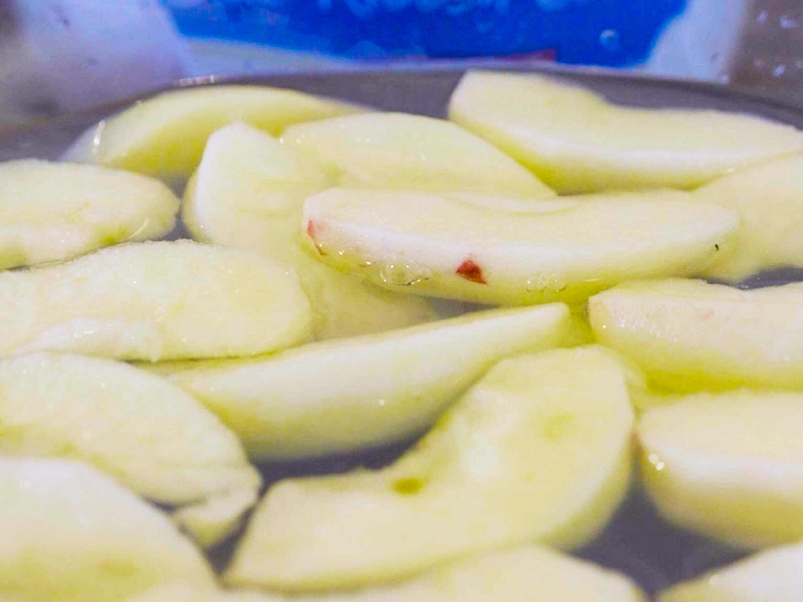 Sliced apples in lemon water.