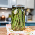 Pickled asparagus in a jar.