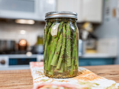 Pickled asparagus in a jar.
