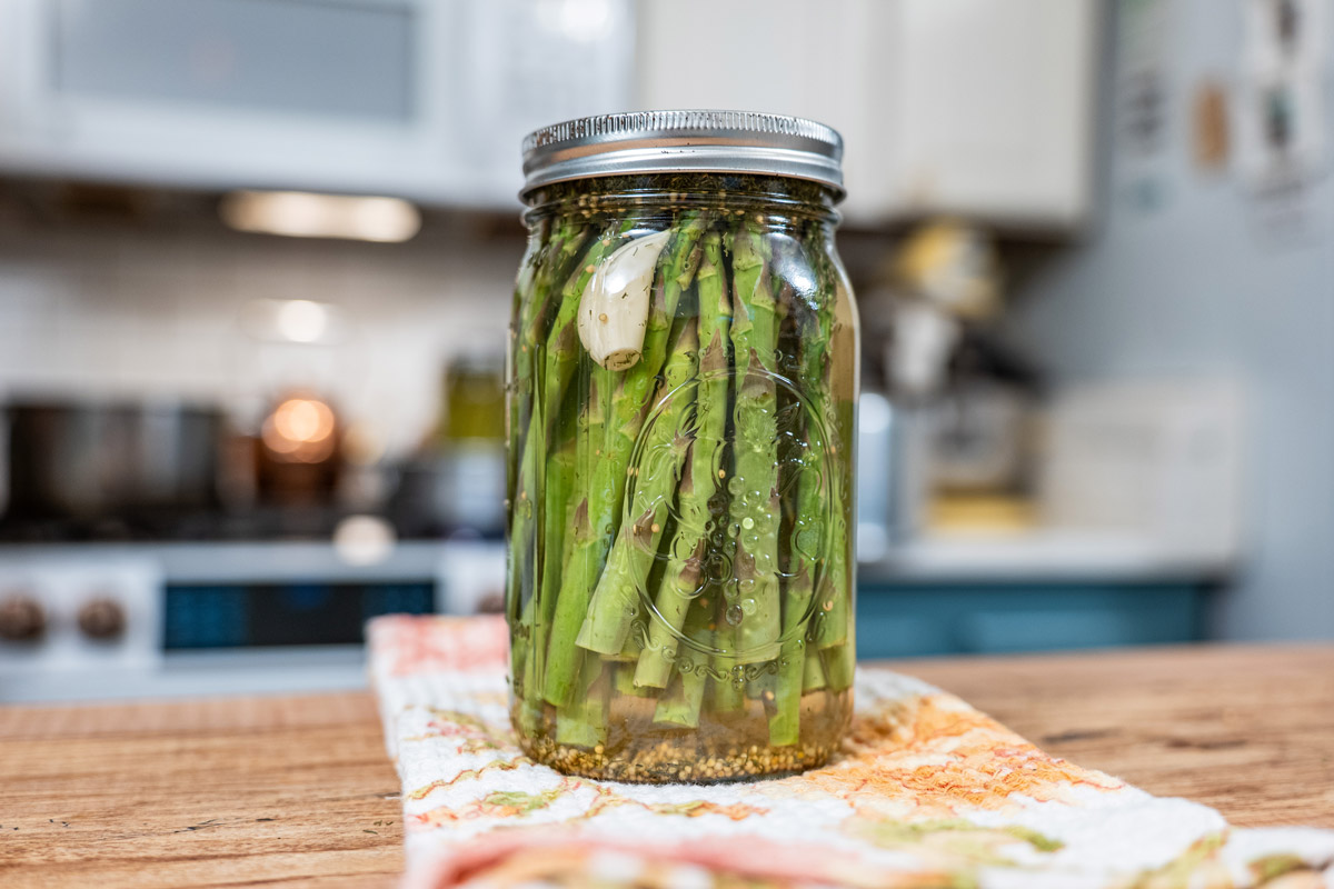 Pickled asparagus in a jar.