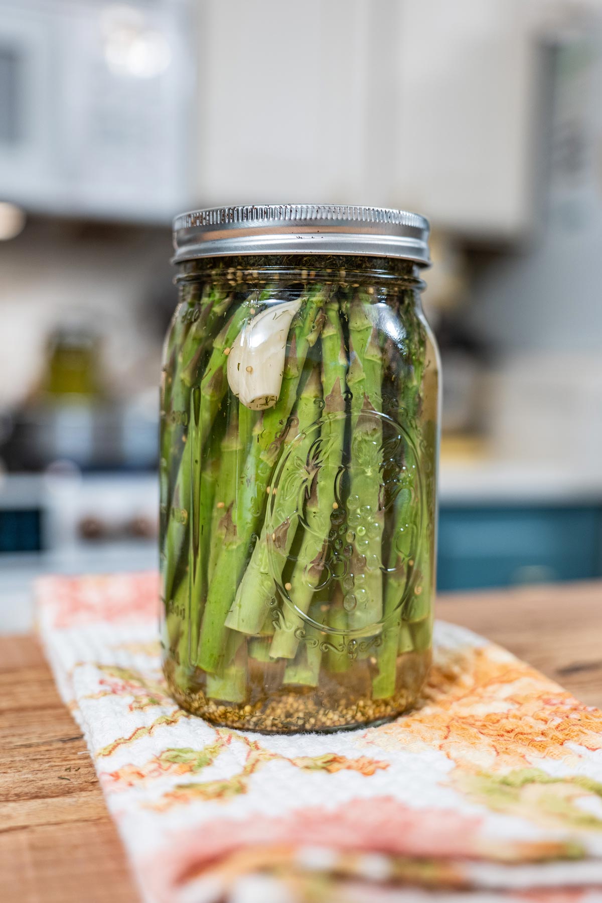 Pickled asparagus in a jar.