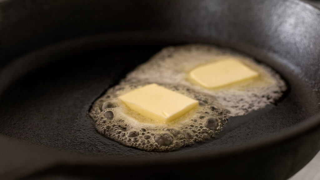 Melting butter in a cast iron pan.
