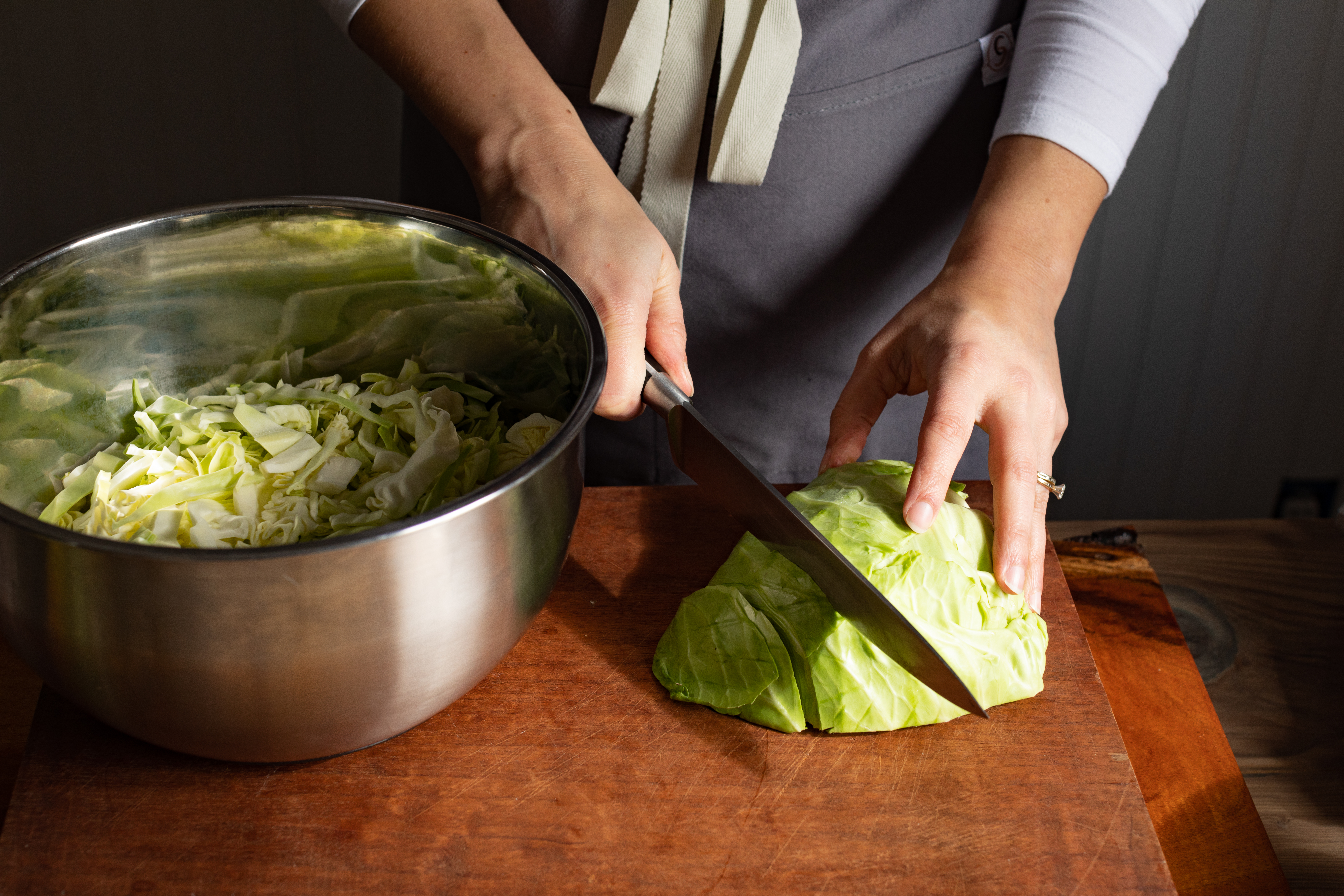 Melissa cutting cabbage for a ferment